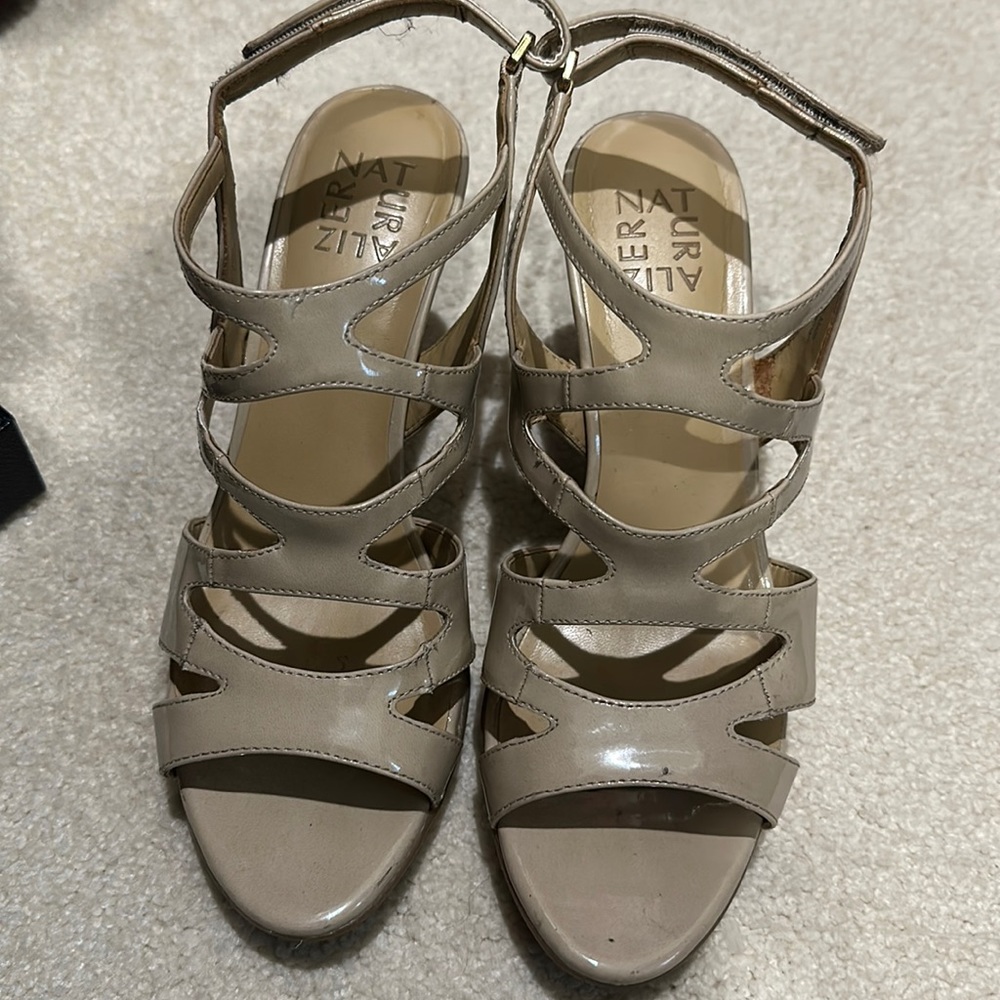 Used light cream shoes, worn 2-3 times. Paint peeling on edge of one shoe.